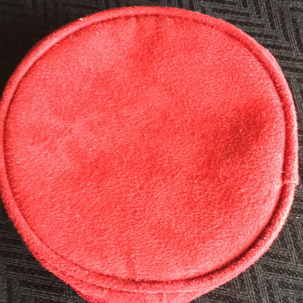 Round red velvet cosmetic bag.
